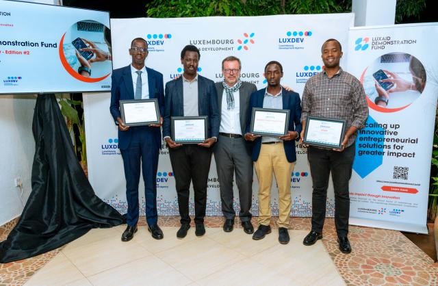 Group of 5 men with certificates