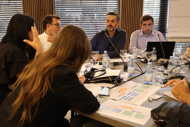 Group work during workshop sitting around table