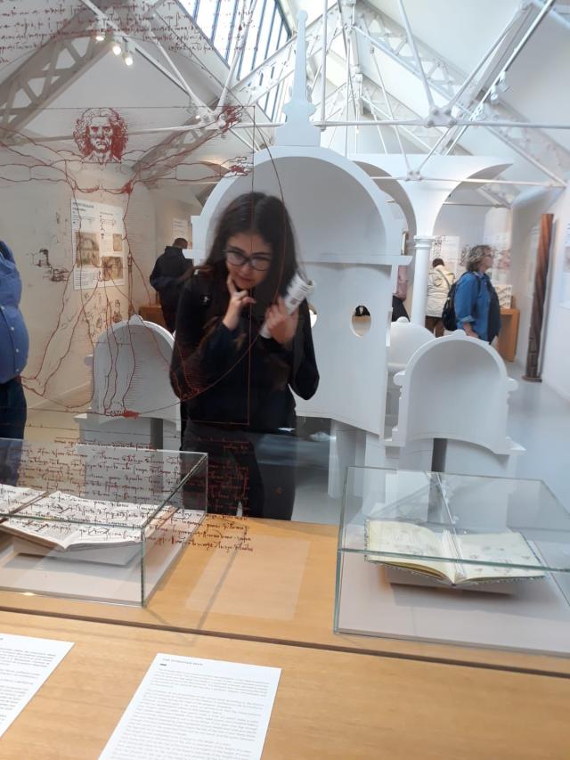 Liza observing museum artefacts