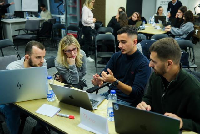 Participants at Hackathon discussing ideas
