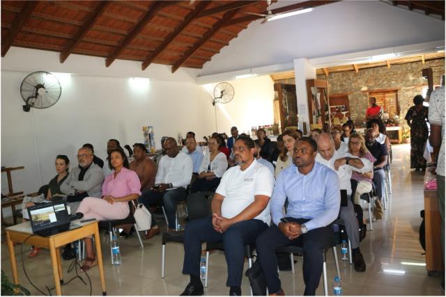 This is a picture of LuxDev and other sustainability professionals attending a conference on the topic, currently looking at the screen.