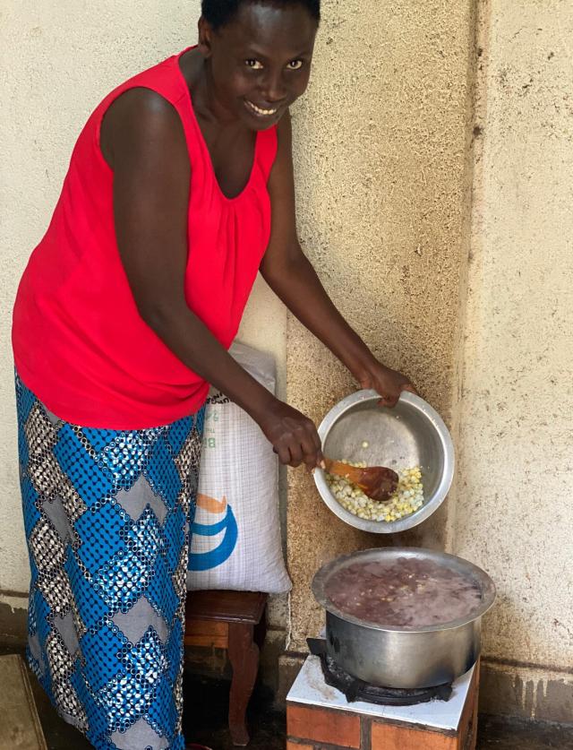 Woman in front of her BioMassters pellet stove