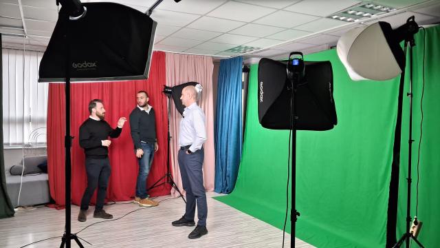 Staff preparing for filming content in a studio
