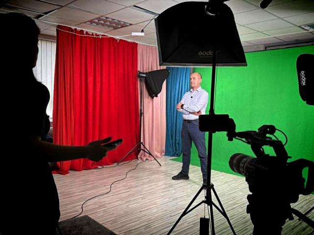 An actors prepares for recording video tutorials in a studio