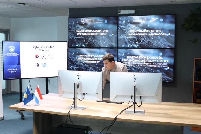 Experts operating the dashboard at the cybersecurity lab