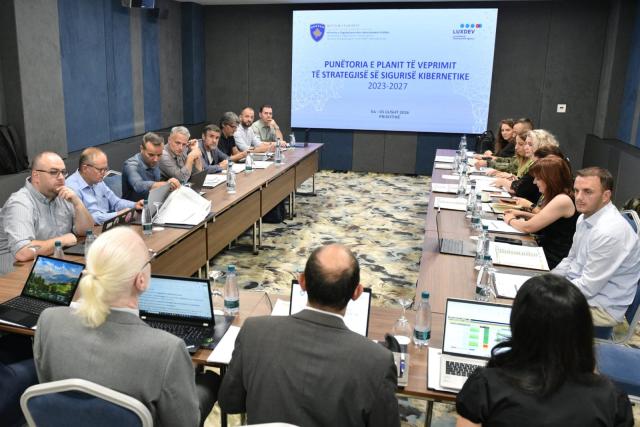 Opening of the workshop with officials sitting around the table