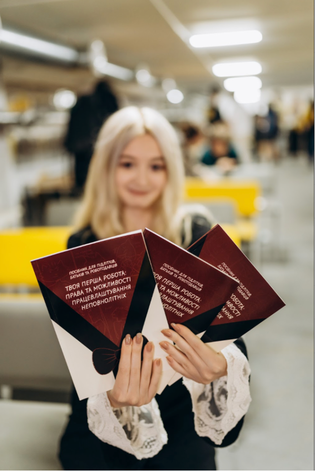 Teenager holding practical guides